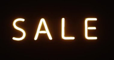 Siyah arkaplanda neon satışı metninin bileşimi. Perakende, alışveriş, renk, ışık ve siber pazartesi konsepti.