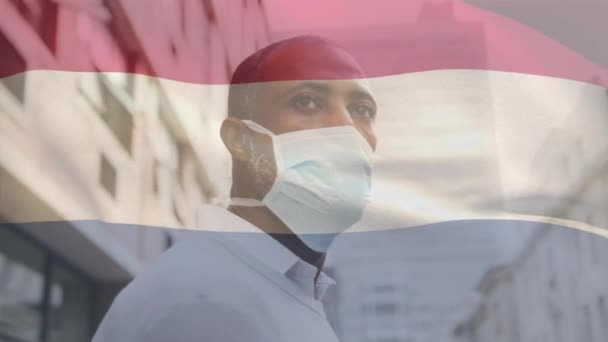 Animation Flag Netherlands Waving African American Man Wearing Face Mask — Stock Video