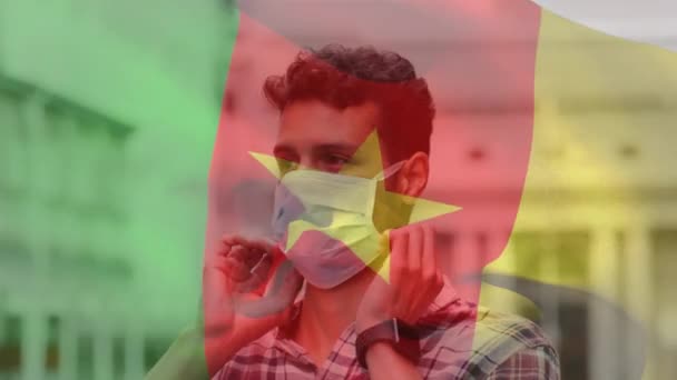 Animation Flag Cameroon Waving Latin Man Wearing Face Mask City — Stock Video