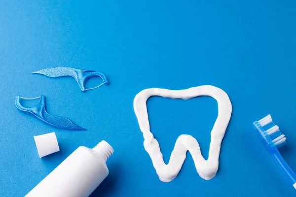 Image Toothbrush Toothpaste Strings Tooth Made Paste Blue Surface Health — Stock Photo, Image