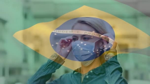 Animation Flag Brazil Waving Caucasian Woman Wearing Face Mask City — Stock Video