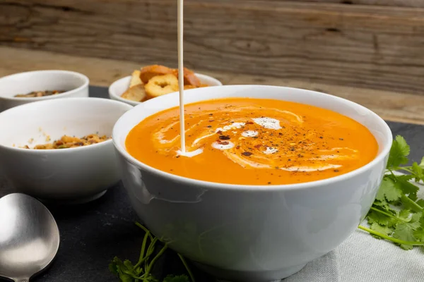 Horizontal Image Cream Pouring Bowl Tomato Soup Toast Leaves Tasty — Stock Photo, Image