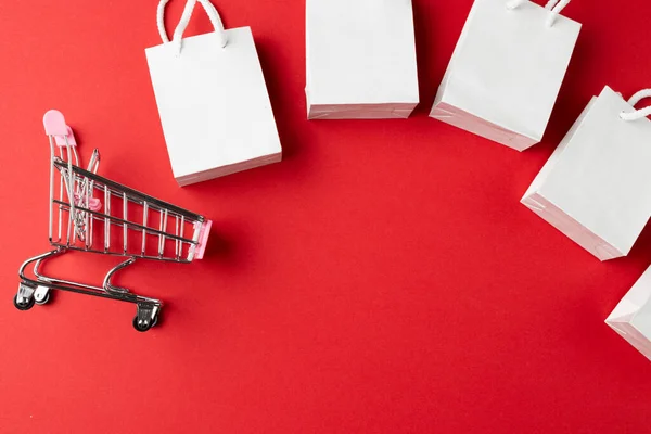 Composition Shopping Cart Bags Red Background Retail Shopping Black Friday — Stock Photo, Image