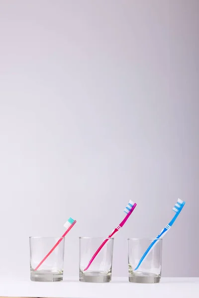 Vertical Image Toothbrushes Glasses Grey Background Health Dentistry Dental Accessories — Stock Photo, Image