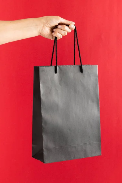 Composition Hand Holding Shopping Bag Pink Background Retail Shopping Black — Stock Photo, Image