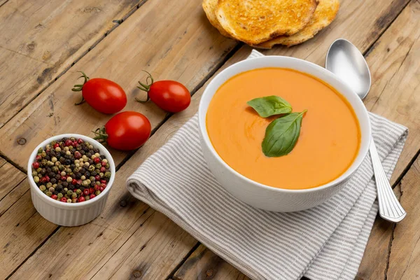Horizontal Image Bowl Tomato Soup Basil Garnish Tomatoes Toast Peppercorns — Stock Photo, Image