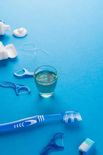 Vertical Image Toothbrush Toothpaste String Liquid Blue Surface Health Dentistry — Stock Photo, Image