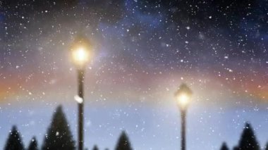 Noel 'de kış manzarasına düşen ışık ve karın animasyonları. Noel geleneği ve kutlama konsepti dijital olarak oluşturulmuş video.