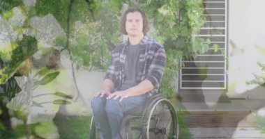 Tekerlekli sandalyede oturan engelli beyaz adamın yapraklarının animasyonu. Uluslararası Engelliler Günü konsepti dijital olarak oluşturulmuş video.