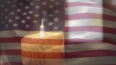 Mum üzerinde Amerikan bayrağının canlandırılması. Küresel vatanseverlik ve dijital arayüz kavramı dijital olarak oluşturulmuş video.