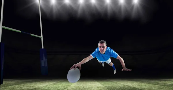 Composition Male Rugby Player Diving Holding Ball Rugby Pitch Sport — Stock Photo, Image
