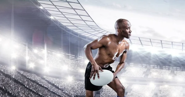 Composição Jogador Rugby Masculino Sem Camisa Segurando Bola Rugby Sobre — Fotografia de Stock
