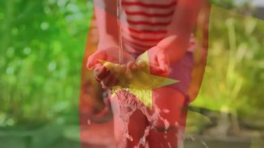 Kamerun bayrağının el yıkayan kadın üzerinde canlandırması. Ulusal bayraklar ve vatanseverlik kavramı dijital olarak oluşturuldu.