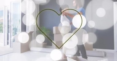 Sarı neon kalp ve beyaz noktaların animasyonu kutular arasında dans eden mutlu çift üzerinde. Aşk, birliktelik, romantizm ve gelecek konsepti dijital olarak oluşturulmuş video.