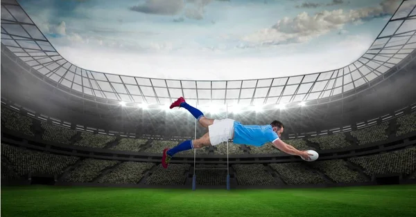 Composition of male rugby player diving holding ball on rugby pitch. sport and competition concept digitally generated image.