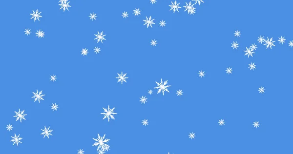 Afbeelding Van Meerdere Gloeiende Sneeuwvlokken Deeltjes Vallen Tegen Een Blauwe — Stockfoto