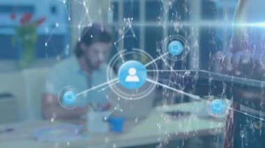 Animation of network of connections with icons over diverse business people at office. Global business, connections and digital interface concept digitally generated video.