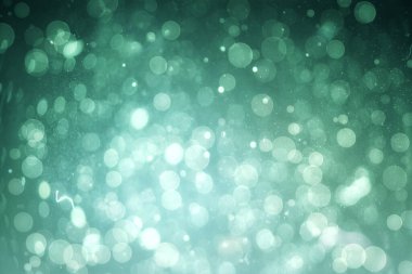 Yeşil arka planda Bokeh ışık lekelerinin soyut çizimi. Soyut şekil ve doku kavramına sahip arkaplan