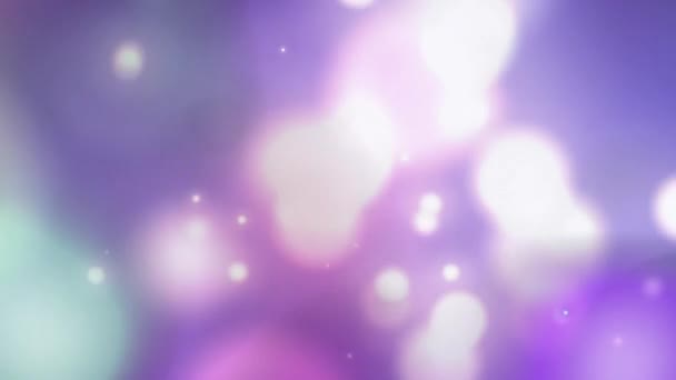 多个发亮的白色和粉色光斑在紫色背景中以催眠动作移动的动画 彩色和运动概念数字生成的图像 — 图库视频影像