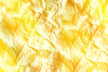 Sarı arka planda buruşuk kağıt dokunun soyut çizimi. soyut doku kavramına sahip arkaplan