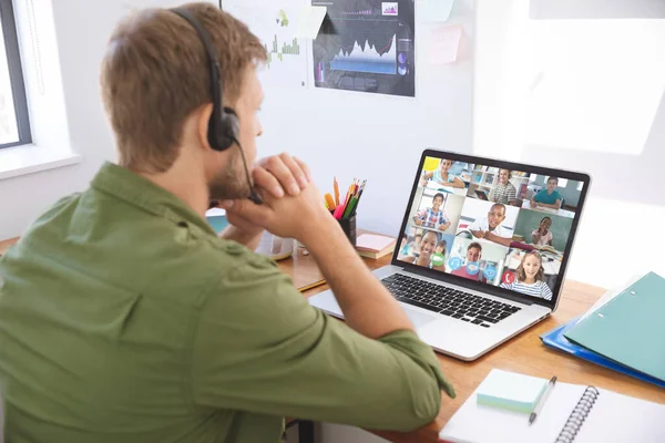 Male Teacher Wearing Headphones Having Video Conference Multiple Students Laptop — Stock Photo, Image