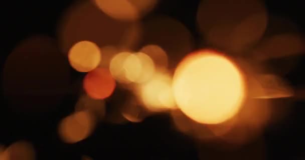 Πολλαπλά Ζεστά Πορτοκαλί Φώτα Τρεμοπαίζουν Μαύρο Φόντο Χριστούγεννα Πρωτοχρονιά Παραμονή — Αρχείο Βίντεο