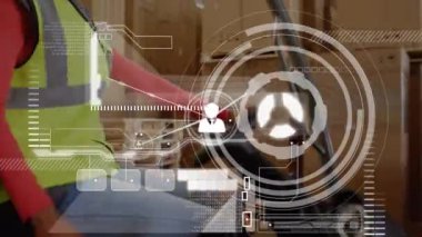 Animation of data processing over biracial female worker in warehouse. Global business and digital interface concept digitally generated video.