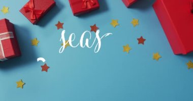 Mavi yüzeyde sunulan sunumlarda mevsim kutlamalarının animasyonu. Noel, kış, gelenek ve kutlama konsepti dijital olarak oluşturuldu.