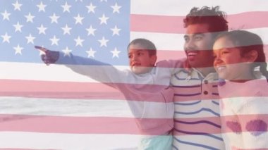 Amerika Birleşik Devletleri bayrağının deniz kenarında oğlu ve kızı olan melez bir babaya göre canlandırılması. Amerikan vatanseverliği, çeşitlilik ve gelenek konsepti dijital olarak oluşturulmuş video.