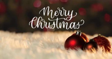 Mutlu noel mesajları eşliğinde mücevherlerin animasyonu. Noel, kutlama ve dijital arayüz kavramı dijital olarak oluşturulmuş video.