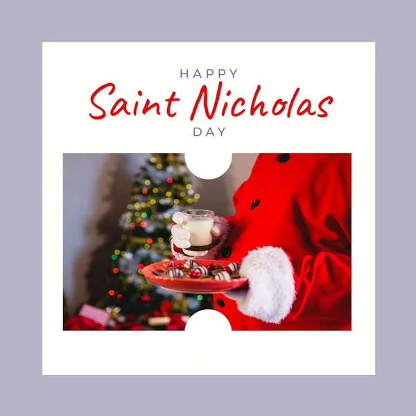 Composition of saint nicholas day text over santa claus holding plate with cookies and milk. Saint nicholas day, christmas festivity, tradition and celebration concept.