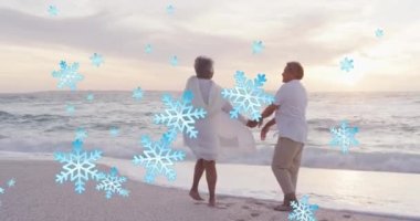 Sahildeki yaşlı çiftlerin üzerine yağan kar animasyonu. Noel, gelenek ve kutlama konsepti dijital olarak oluşturuldu.