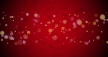 Kırmızı arkaplandaki ışık noktalarının animasyonu. Noel, gelenek ve kutlama konsepti dijital olarak oluşturuldu.