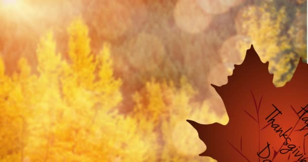 秋の木々の上に幸せな感謝祭と茶色の葉のアニメーション 感謝祭 アメリカの文化とお祝いのコンセプトデジタル生成ビデオ — ストック動画