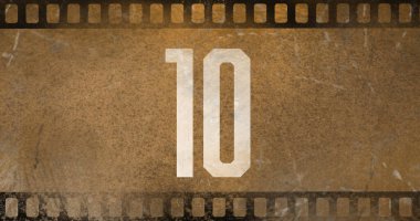 Eski negatif kamera filminde beyaz renkli 10 numaralı metnin birleşimi, kopyalama alanı. Rakamlar, sayma, soyut, retro, film şeridi ve fotoğraf konsepti.