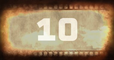 10 numaralı metnin kombinasyonu eski paslı negatif kamera filminin üzerinde vignette ile, kopyalama uzayı. Rakamlar, sayma, soyut, retro, hasarlı ve fotoğrafçılık kavramı.