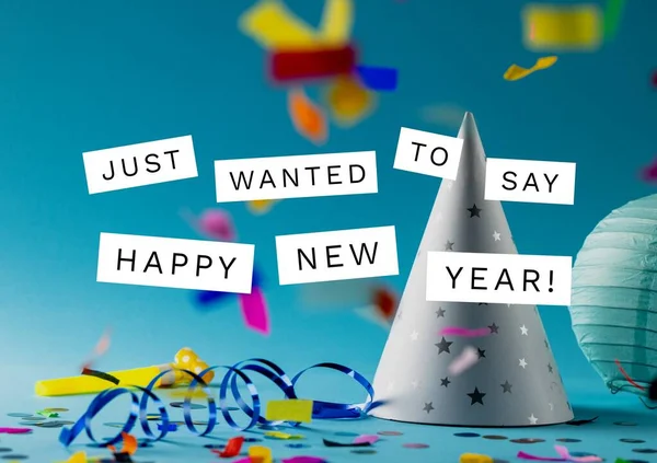 Image of just wanted to say happy new year and party hats with confetti on blue background. New year, party and celebration concept.