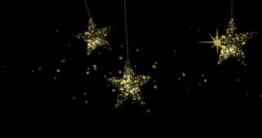 Siyah arkaplandaki altın yıldızların üzerindeki noktaların animasyonu. Noel, kış, gelenek ve yeni yıl konsepti dijital olarak oluşturulmuş video.