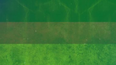 Düşen beyaz moleküllerin yeşil arka planda canlandırılması. Arkaplan ve anlar konsepti dijital olarak oluşturulmuş video.