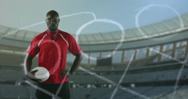 Stadyumdaki ragbi toplu Afro-Amerikan adamın pozisyonunun animasyonu. Spor, rekabet ve strateji konsepti dijital olarak oluşturulmuş video.