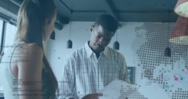 Animation of globe over diverse business people in office. Global business and digital interface concept digitally generated video.