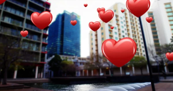Image of hearts over cityscape. Social media, communication, global network, internet and new technology concept.