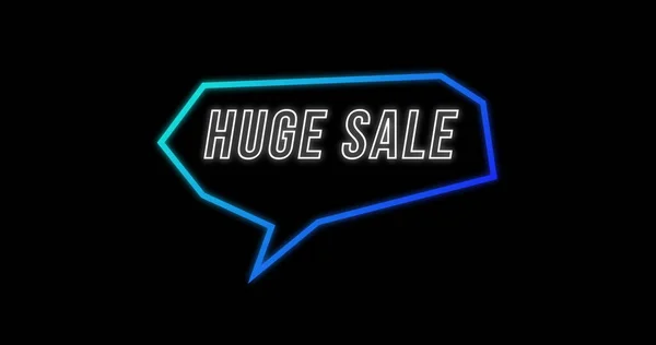 Image of Huge Sale advertisement in Retro Eighties concept with neon communication bubble against black background