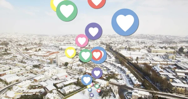 Image of social media hearts over cityscape. Social media, communication, connections, global network and technology concept.