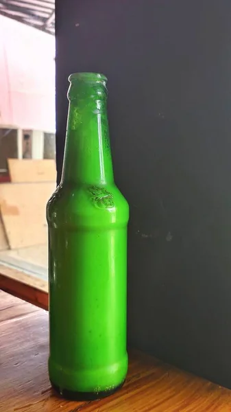Green Glass Bottle Like a Beer on Restaurant Restaurant.