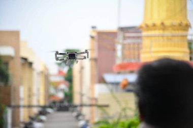 Chennai, India - October 2nd 2022: Drone Dji Mavic Mini 2 Flying Close-up with Extended Landing Gear Leg In Outdoor. clipart