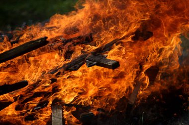 Ancient traditions of burning bonfires in cemeteries, when old crosses were burned and dead relatives were remembered. Cemetery maintenance workers burn old crosses