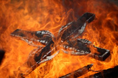 Ancient traditions of burning bonfires in cemeteries, when old crosses were burned and dead relatives were remembered. Cemetery maintenance workers burn old crosses