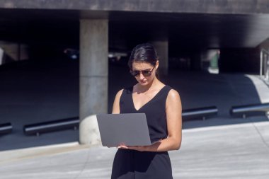 Business woman work on laptop computer at outdoor