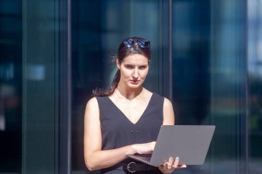 Business woman work on laptop computer at outdoor
